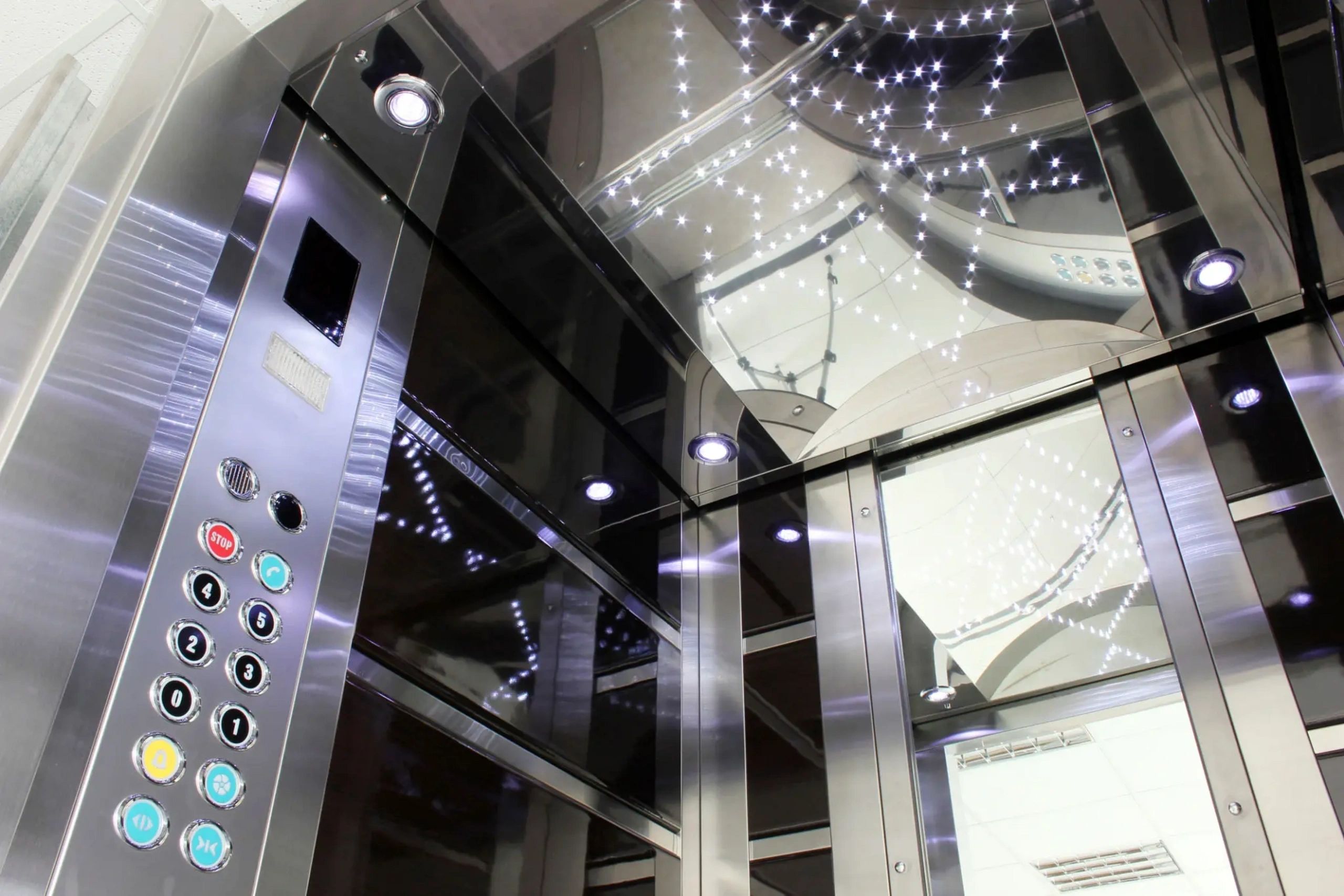 Al Rasco elevator technician inspecting maintenance control panel in Saudi Arabia